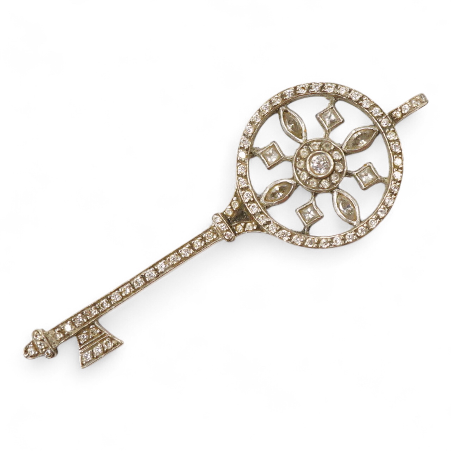 A mid 20th century white metal and diamond cluster set 'key of the door' pendant. 51mm, gross weight 4.6 grams.